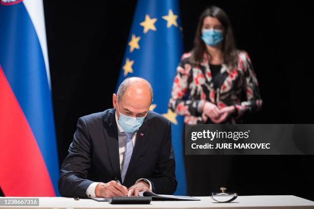 Slovenia's Prime Minister Janez Jansa signs a treaty on cooperation in the economic and social development of the ethnically mixed area on both sides...