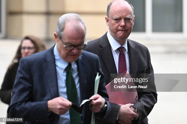 Britain's Chief Scientific Adviser Patrick Vallance and Britain's Chief Medical Officer for England Chris Whitty walk through Westminster on February...