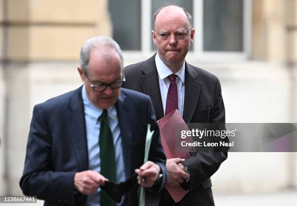 Britain's Chief Scientific Adviser Patrick Vallance and Britain's Chief Medical Officer for England Chris Whitty walk through Westminster on February...