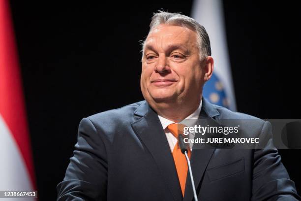 Hungary's Prime minister Viktor Orban reacts during a joint press conference with Slovenia's counterpart Janez Jansa after a meeting in Lendava, a...