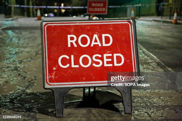 Sign that says road closed blocks a road in London after an incident happened in the area.