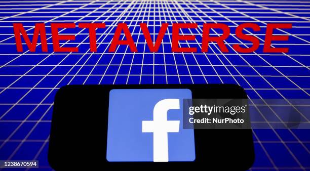 Facebook logo displayed on a phone screen and a 'metaverse' sign displayed on a laptop screen are seen in this illustration photo taken in Krakow,...