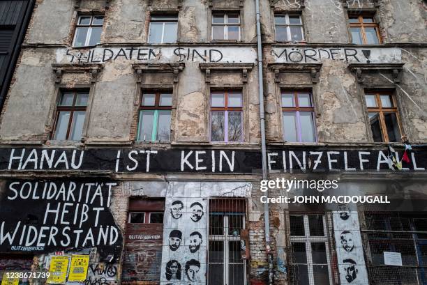 The words "Hanau ist kein Einzelfall" are painted on the facade of a squatted building in Berlin on February 21 to commemorate the victims of the...