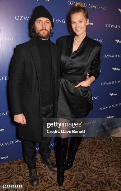 Alex Pettyfer and Toni Garrn attend the Ozwald Boateng show during London Fashion Week February 2022 at The Savoy Theatre on February 21, 2022 in...