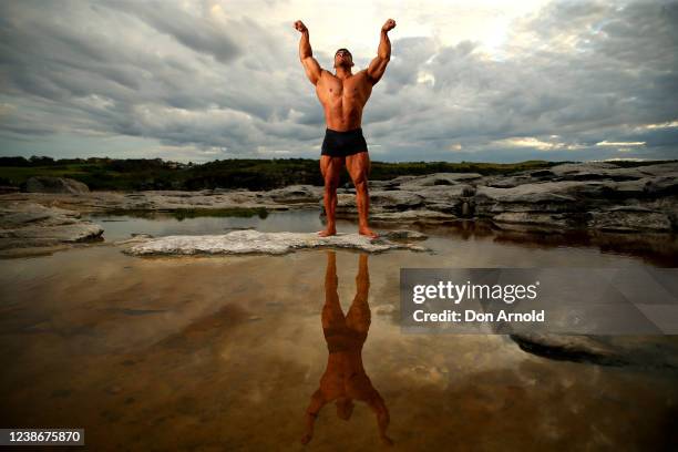 Chris Kavvalos poses during an early morning photo shoot at Little Bay on May 31, 2020 in Sydney, Australia. IFBB body builder Chris Kavvalos has...