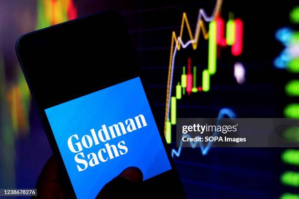 In this photo illustration, a Goldman Sachs logo is displayed on a smartphone screen.