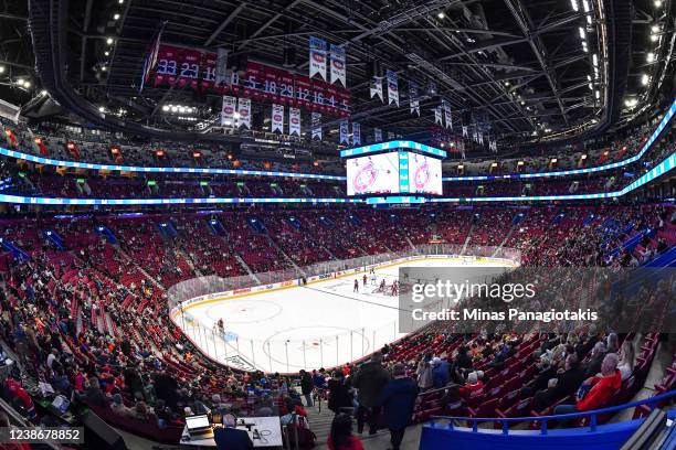 Fans fill in the arena at half capacity prior to the opening face-off between the Montreal Canadiens and the Toronto Maple Leafs at Centre Bell on...