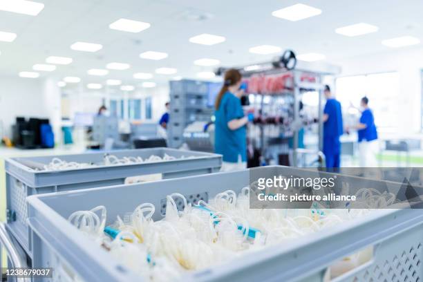 February 2022, North Rhine-Westphalia, Hagen: Blood plasma is filtered from a blood donation by centrifuge in the central laboratory of the DRK blood...