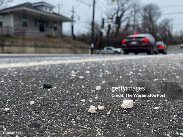 January 28 : Large pieces of road salt sit on Minnesota Ave NE before snow begins to fall in the Deanwood neighborhood of Washington, DC on January...