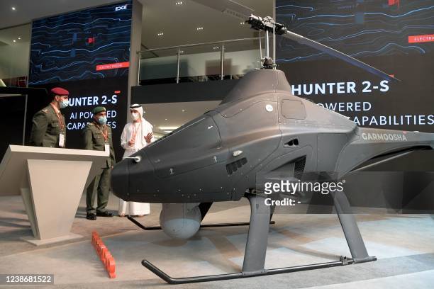 Visitors view a Garmoosha light unmanned aircraft system by the EDGE advanced technology group for defence on display at the UMEX Exhibition...