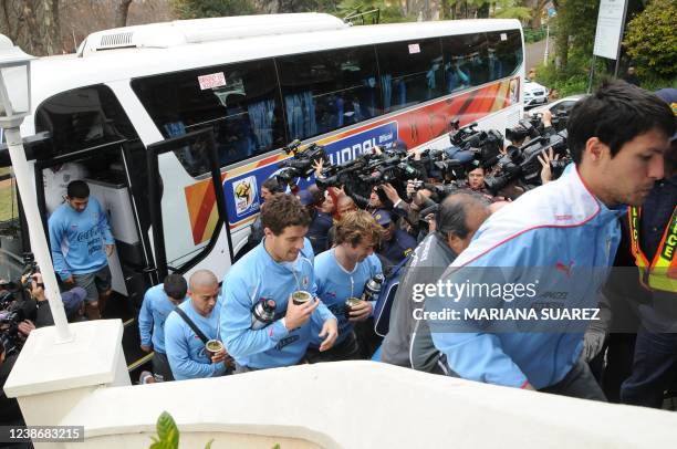 Uruguay's Ignacio Gonzalez, Diego Lugano, Andres Scotti, Egidio Arevalo, Maximiliano Pereira and Walter Gargano arrive at the team's hotel in...