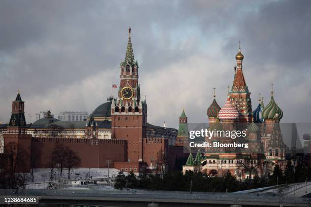 The Spasskaya tower of the Kremlin, center, and Saint Basil's Cathedral, right, in Moscow, Russia, on Tuesday, Feb. 22, 2022. The ruble tumbled the...