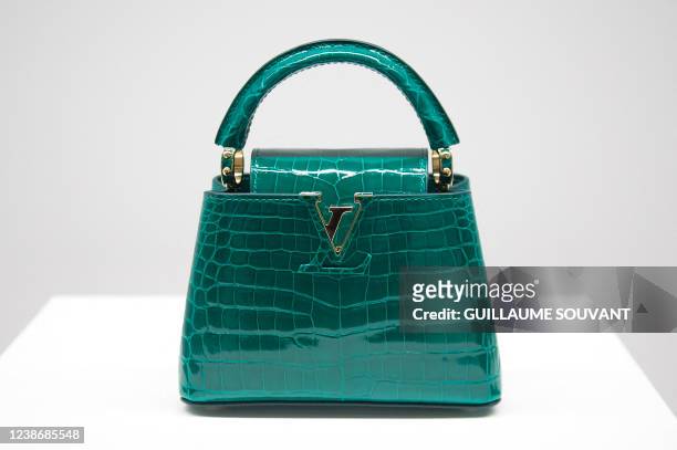 Picture taken on February 22, 2022 shows a Louis Vuitton Capucines handbag displayed during the inauguration of the Louis Vuitton workshop named...