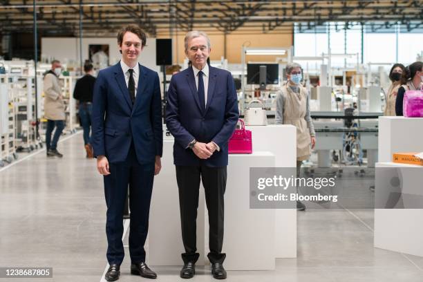 Bernard Arnault, billionaire and chairman of LVMH Moet Hennessy Louis Vuitton SE, right, and Frederic Arnault, chief executive officer of Tag Heure...