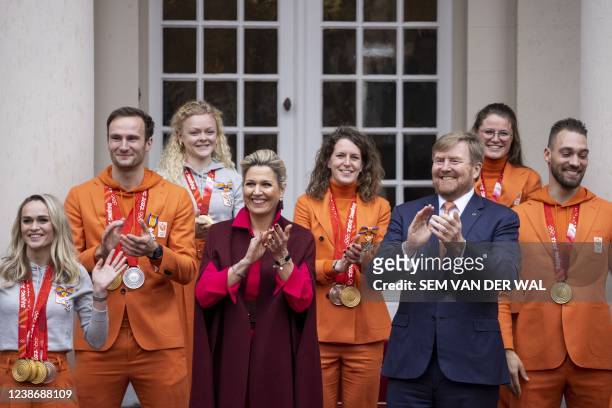 King Willem-Alexander and Queen Maxima pose on the steps of Noordeinde Palace for a family photograph the Dutch medalists of the 2022 Beijing Winter...