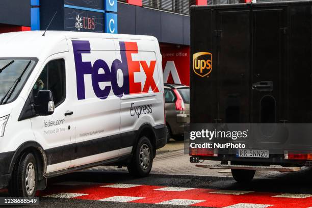 FedEx and UPS delivery vans are seen in Krakow, Poland on February 22, 2022.