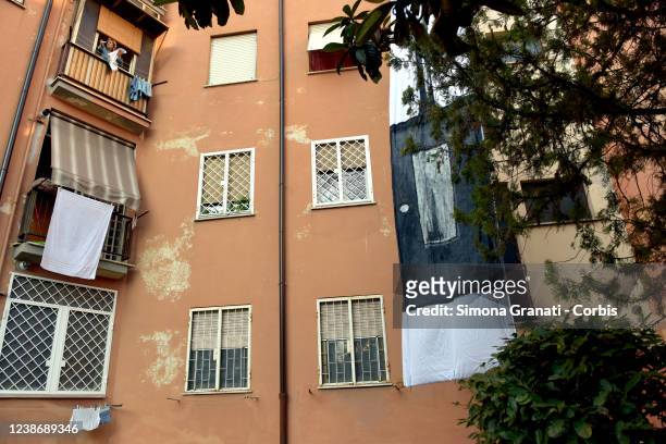 Inhabitants of council houses in Lamaro Cinecittà lower a banner from the buildings depicting a lift, on February 22, 2022 in Rome, Italy....