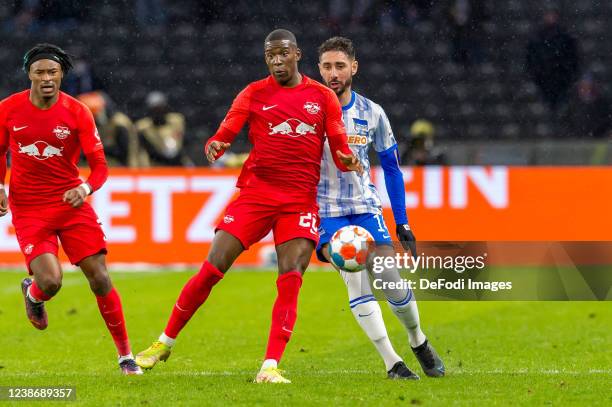 Nordi Mukiele of RB Leipzig and Ishak Belfodil of Hertha BSC battle for the ball during the Bundesliga match between Hertha BSC and RB Leipzig at...