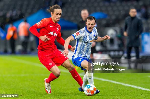 Yussuf Poulsen of RB Leipzig and Vladimir Darida of Hertha BSC battle for the ball during the Bundesliga match between Hertha BSC and RB Leipzig at...