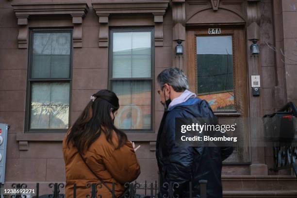 Prospective renters wait outside to enter an apartment unit during an open house in the Bedford-Stuyvesant neighborhood in the Brooklyn borough of...