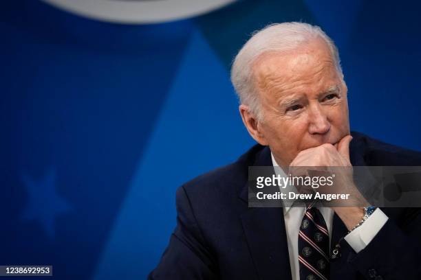 President Joe Biden participates in a virtual meeting about mineral supply chains and clean energy manufacturing in the South Court Auditorium of the...