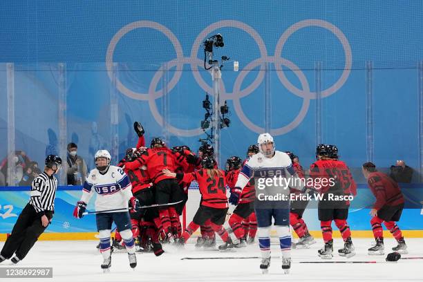 Winter Olympics: Rear view of Canada players victorious on ice after winning game vs USA during Gold Medal Game at Wukesong Sports Centre. Canada...