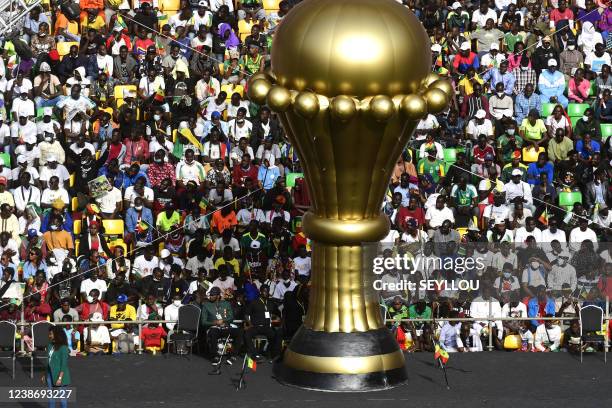 An inflatable replica of the African Cup of Nations sits past the grandstand during the inauguration of the Stade de Senegal, in Diamniadio, 30...