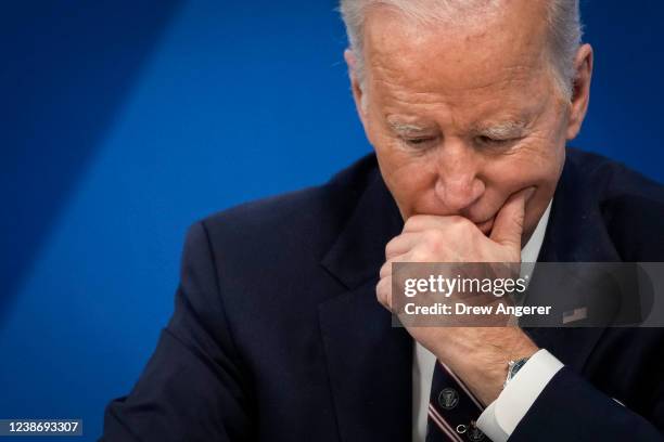 President Joe Biden participates in a virtual meeting about mineral supply chains and clean energy manufacturing in the South Court Auditorium of the...