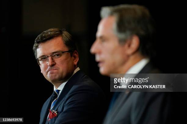 Ukraine's Foreign Minister Dmytro Kuleba looks to Secretary of State Antony Blinken as he speaks during a news conference at the State Department in...