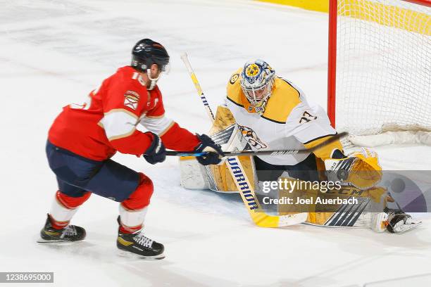 Goaltender David Rittich of the Nashville Predators stops a shot on a breakaway by Aleksander Barkov of the Florida Panthers during second period...