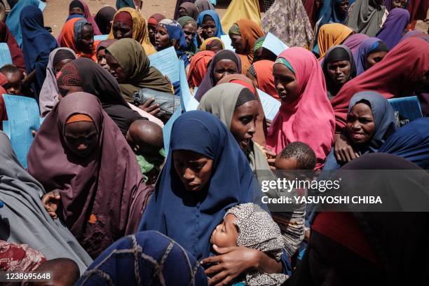 Mothers wait for high nutrition foods and health services at Tawkal 2 Dinsoor camp for internally displaced persons in Baidoa, Somalia, on February...