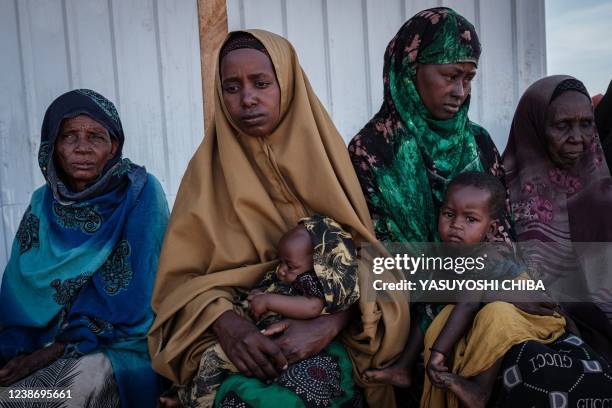 Recently arrived people from the countryside of southern Somalia, one of the regions hardest hit by the drought, wait for help at Muuri camp, one of...