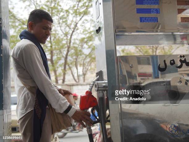 Man refuels his car during ongoing fuel crisis in Taiz, Yemen on February 20, 2022. Fuel went on the black market due to fuel crisis caused by...
