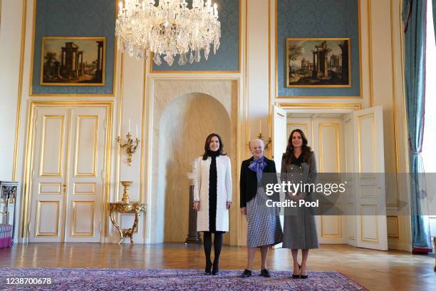 Catherine, Duchess of Cambridge is welcomed by Queen Margrethe II and Crown Princess Mary of Denmark during an audience at Christian IX's Palace on...