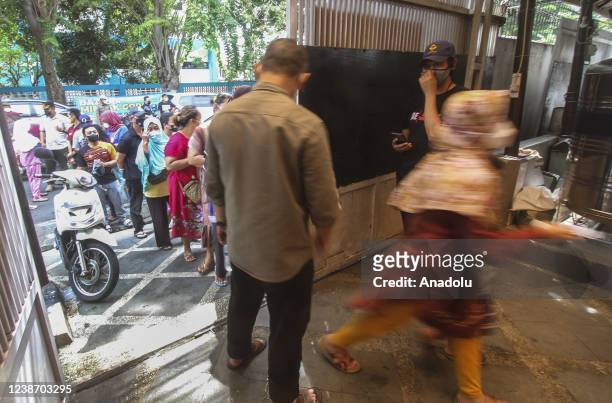 Hundreds of people line up to get cooking oil in Rawamangun, Jakarta, Indonesia on February 23, 2022. The cheap market holds in Rawamangun, East...