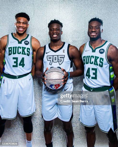 Giannis Antetokounmpo of the Milwaukee Bucks, Alex Antetokounmpo of Raptors 905 and Thanasis Antetokounmpo of the Milwaukee Bucks pose for a portrait...