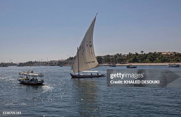 Boats sail along the Nile river in Aswan in Upper Egypt, some 920km south of the capital Cairo, on February 23, 2022.