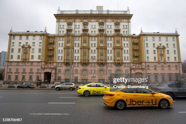 Taxis operated by Uber Technologies Inc. Pass the U.S. Embassy building in Moscow, Russia, on Wednesday, Feb. 23, 2022. U.S. President Joe Biden's...