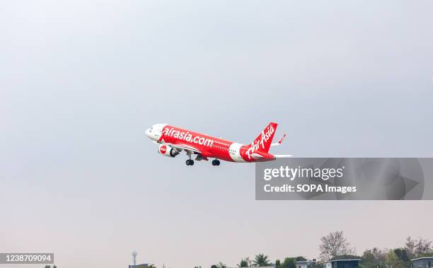 AirAsia airplane takes off from Chiang Mai International Airport . .