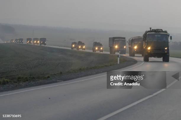 Convoy of Russian military vehicles is seen as the vehicles move towards border in Donbas region of eastern Ukraine on February 23, 2022 in Russian...