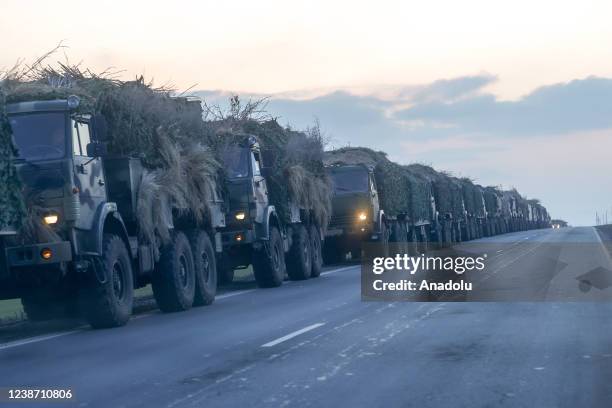 Convoy of Russian military vehicles is seen as the vehicles move towards border in Donbas region of eastern Ukraine on February 23, 2022 in Russian...