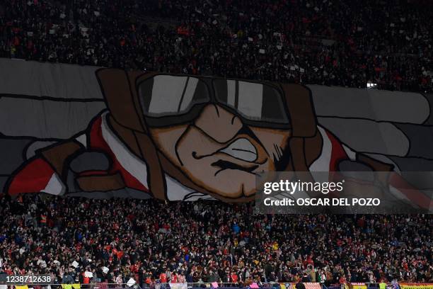 Atletico Madrid's supporters deploy a banner during the UEFA Champions League football match between Atletico de Madrid and Manchester United at the...