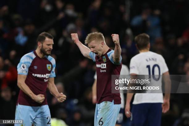 Burnley's English defender Ben Mee celebrates at the end of the English Premier League football match between Burnley and Tottenham at Turf Moor in...