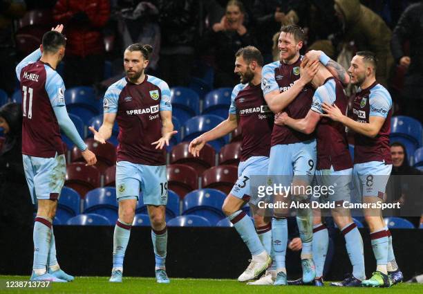 Burnley's Ben Mee celebrates scoring the opening goal with teammates during the Premier League match between Burnley and Tottenham Hotspur at Turf...