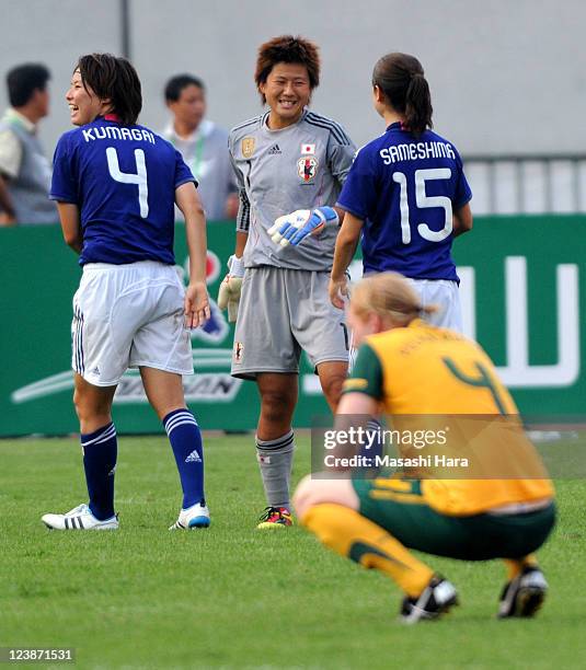 Saki Kumagai, Ayumi Kaihori and Aya Sameshima of Japan at the final whistle during the London Olympic Women's Football Asian Qualifier match between...