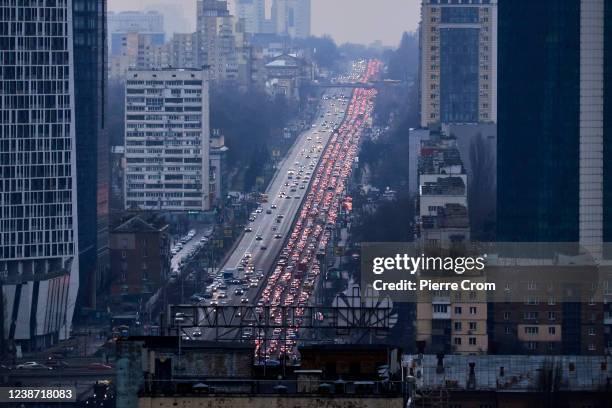 Inhabitants of Kyiv leave the city following pre-offensive missile strikes of the Russian armed forces and Belarus on February 24, 2022 in Kyiv,...