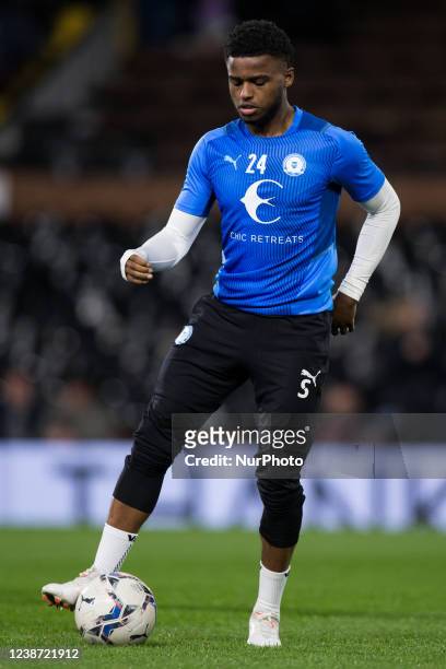 Bali Mumba of Peterborough United warms up during the Sky Bet Championship match between Fulham and Peterborough at Craven Cottage, London on...