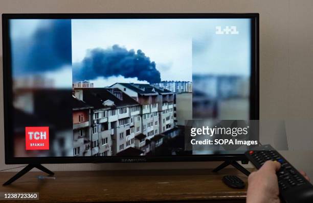 Television screen showing news reports on the shelling of the airport in Ivano-Frankivsk. Today, many Ukrainians were awakened by explosions at 5 am....