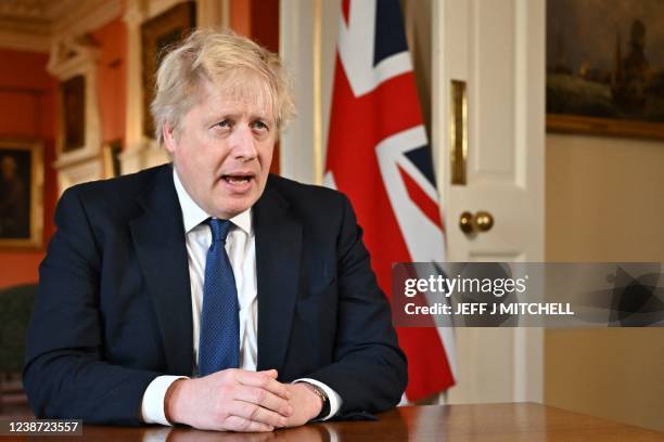 Britain's Prime Minister Boris Johnson speaks from 10 Downing Street, in London, on February 24, 2022 during an address to the nation on Russia's...