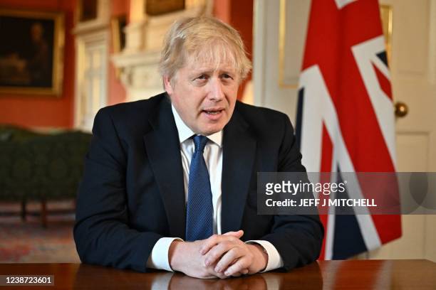 Britain's Prime Minister Boris Johnson speaks from 10 Downing Street, in London, on February 24, 2022 during an address to the nation on Russia's...